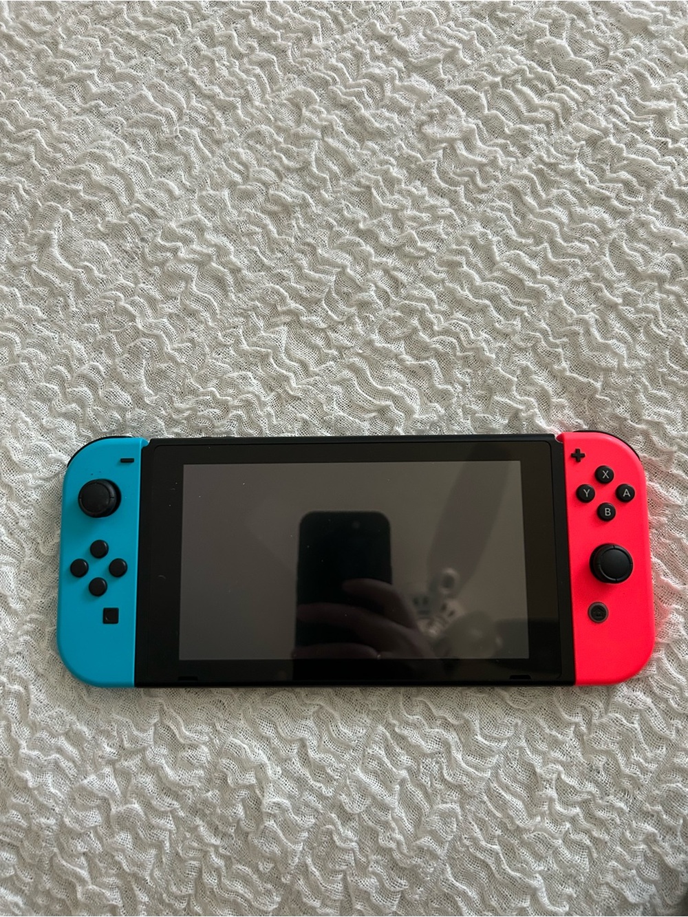 Nintendo Switch with Bright Blue and Bright Red Joy‑Con